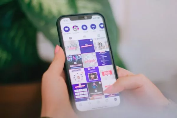 A person holding a cell phone in their hand